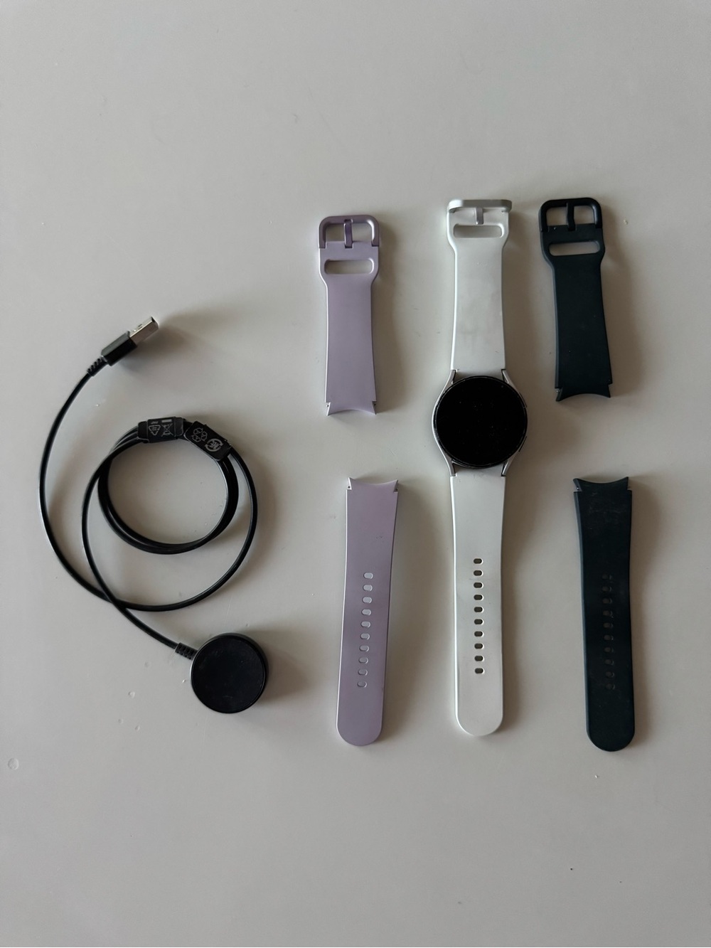 Samsung Galaxy Watch 4 - 40mm with White, Green, and Lavender Silicone Bands